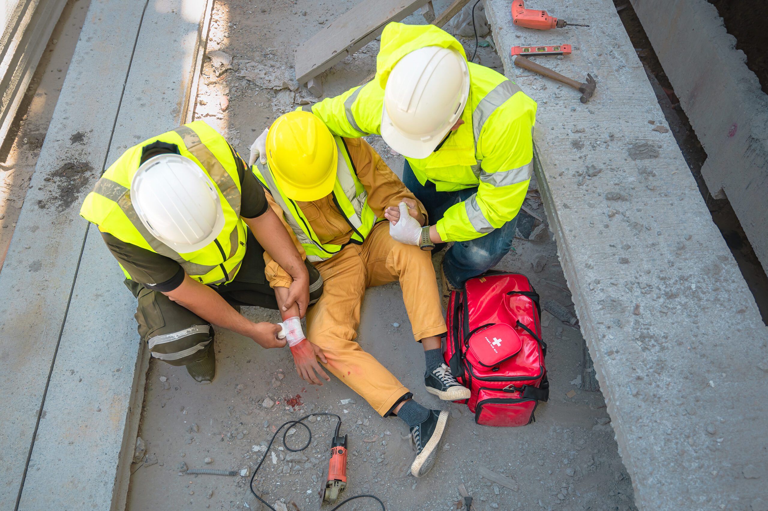 Men applying first aid